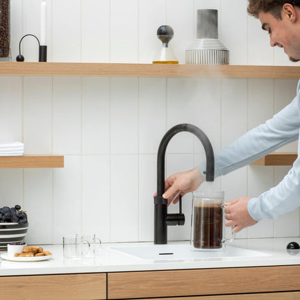 Quooker kran med kokende vann i springen